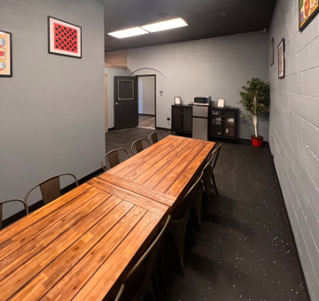 The table looking toward the counter, microwave and cabinets