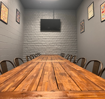 View down the table to the wall-mounted TV
